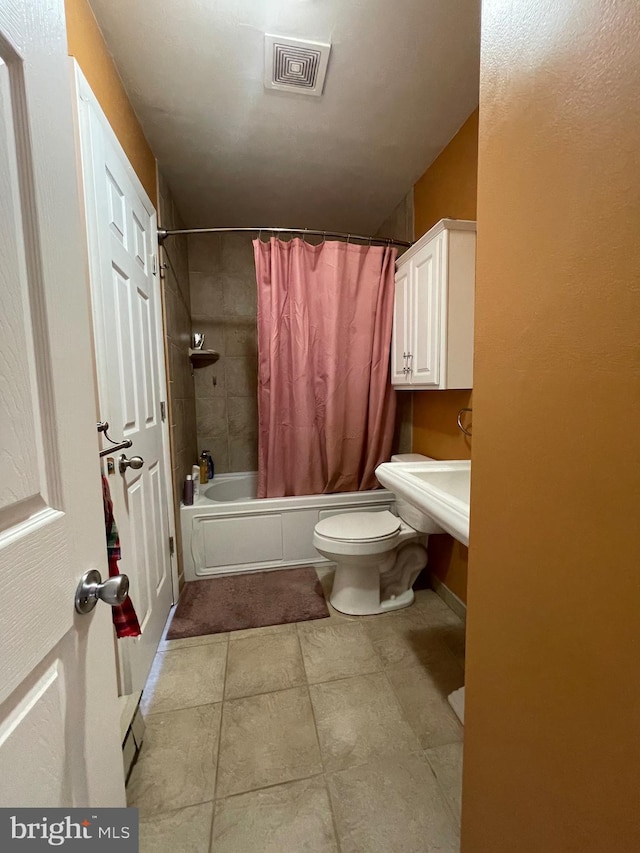 full bathroom featuring toilet, visible vents, and shower / bath combination with curtain