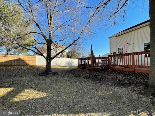 view of yard featuring fence private yard and a deck