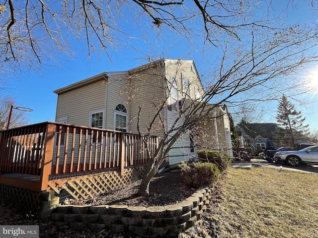 view of home's exterior with a deck