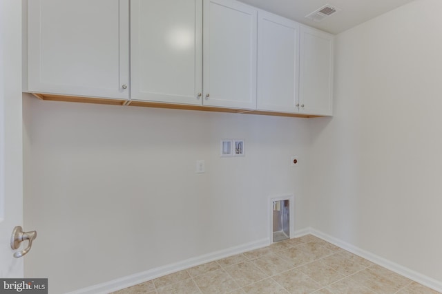 laundry area with cabinet space, baseboards, visible vents, hookup for a washing machine, and electric dryer hookup