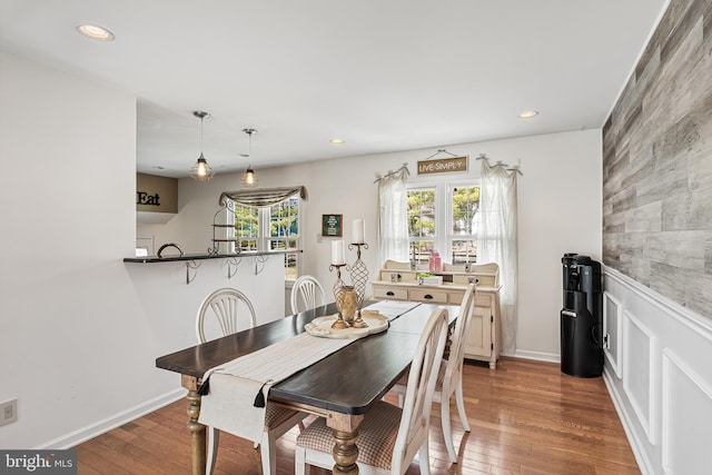 dining space featuring recessed lighting, baseboards, and hardwood / wood-style floors