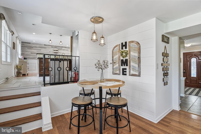 dining space featuring recessed lighting and wood finished floors