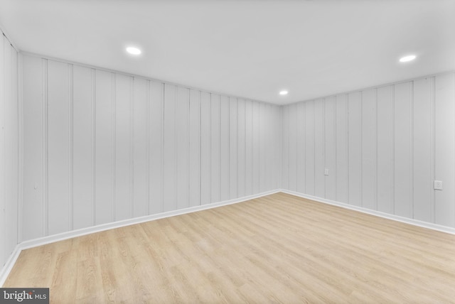 basement featuring recessed lighting and wood finished floors