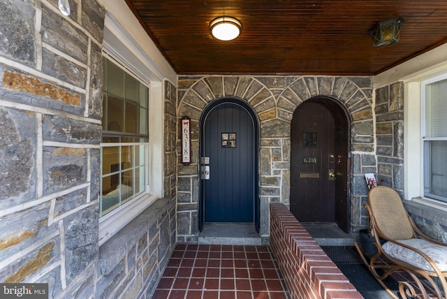 view of exterior entry with stone siding