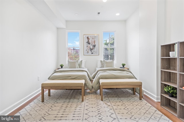 sitting room featuring light wood-type flooring, visible vents, baseboards, and recessed lighting