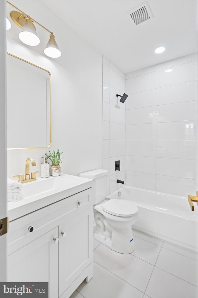 bathroom with shower / bathtub combination, toilet, vanity, visible vents, and tile patterned floors