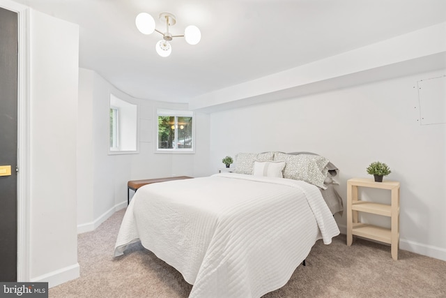 carpeted bedroom with baseboards