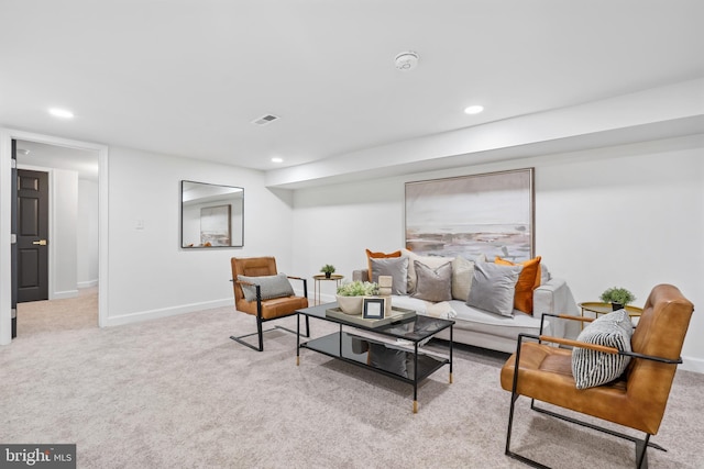 living area with recessed lighting, baseboards, visible vents, and light colored carpet