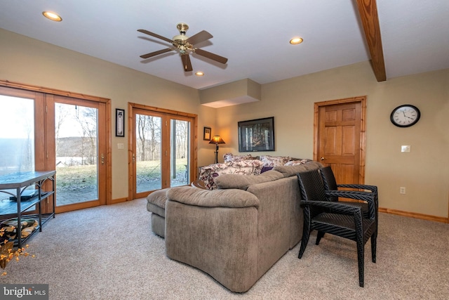 living area featuring recessed lighting, light carpet, and baseboards