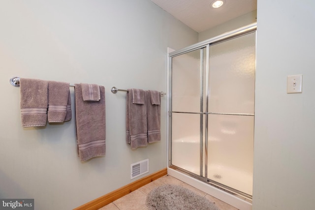 bathroom featuring recessed lighting, visible vents, a stall shower, baseboards, and tile patterned floors