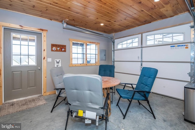 garage with wood ceiling and electric panel