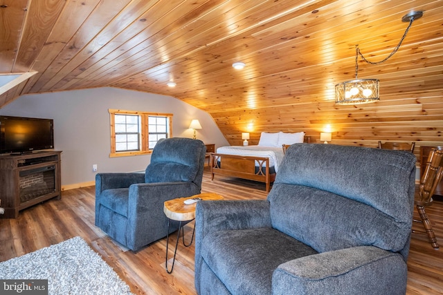 living area featuring vaulted ceiling, wood finished floors, wood ceiling, and baseboards