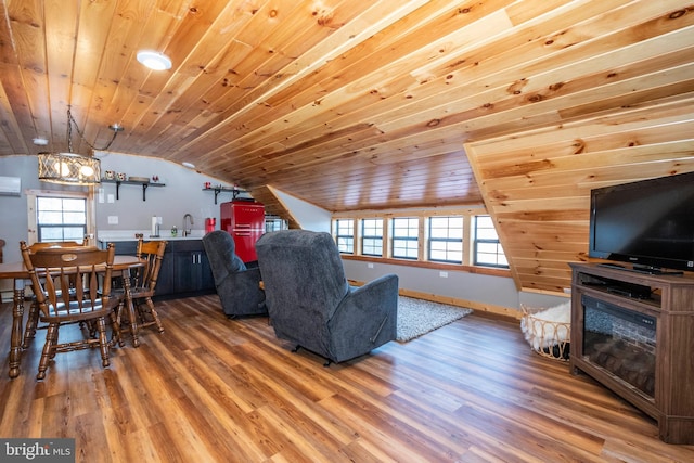 living room featuring a healthy amount of sunlight, wood ceiling, and wood finished floors