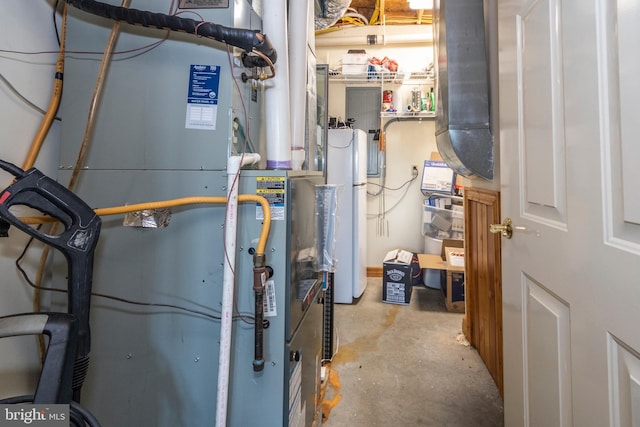 utility room with water heater