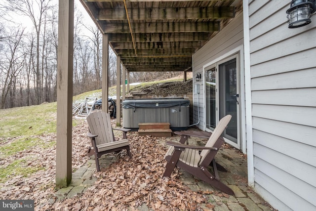 view of patio with a hot tub