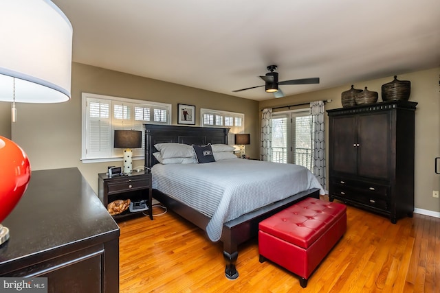 bedroom featuring ceiling fan, baseboards, light wood-style floors, and access to outside