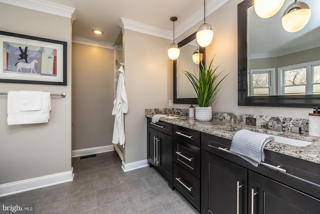 full bath featuring a shower with curtain, crown molding, baseboards, and double vanity