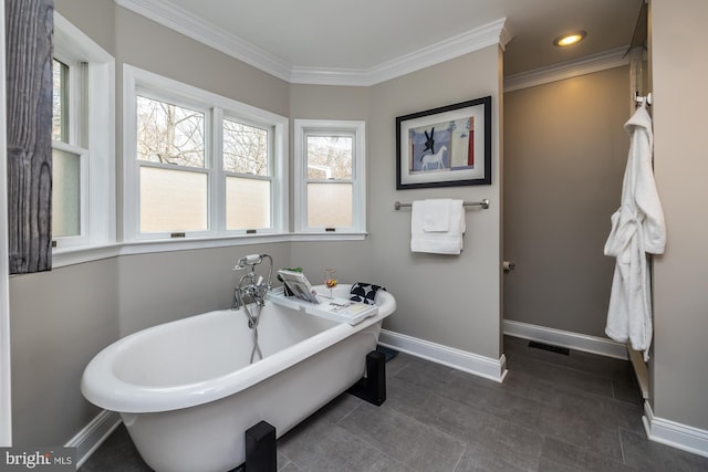 bathroom featuring visible vents, baseboards, a freestanding tub, recessed lighting, and ornamental molding