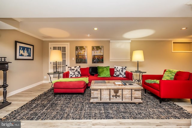 living area with recessed lighting, crown molding, baseboards, and wood finished floors