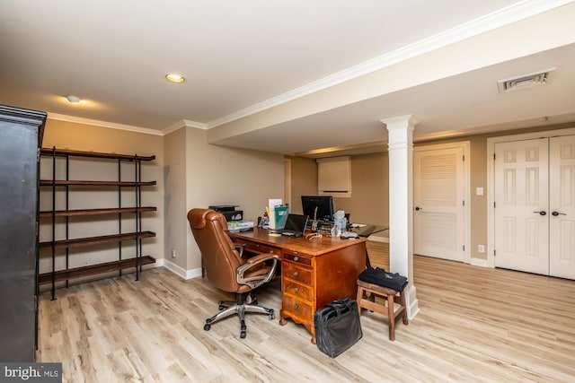 office with baseboards, wood finished floors, visible vents, and ornamental molding