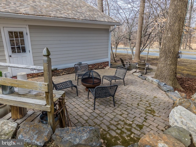 view of patio featuring an outdoor fire pit