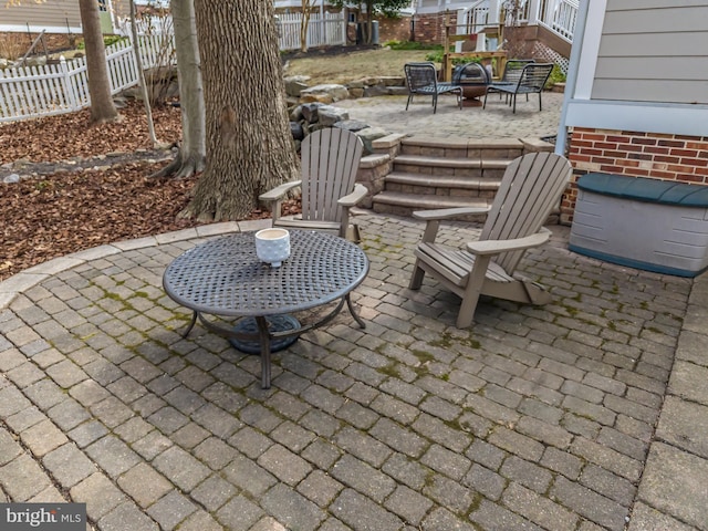 view of patio / terrace featuring fence