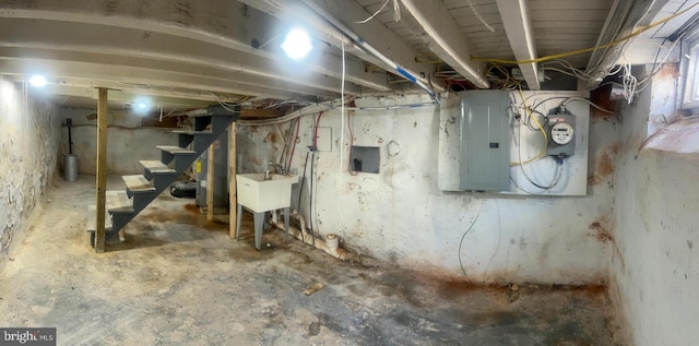 2837 Stouton St, Philadelphia, PA 19134 - unfinished basement with electric panel, stairway, and a sink