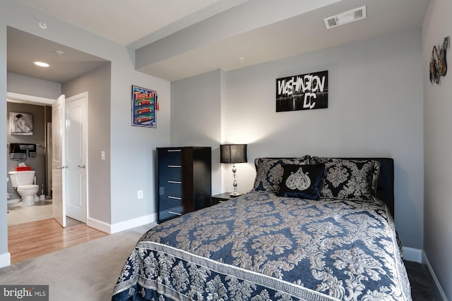 bedroom featuring visible vents and baseboards