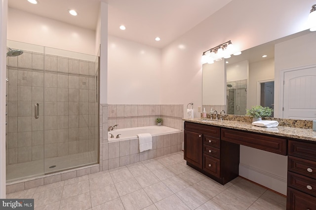 bathroom with tile patterned flooring, recessed lighting, vanity, a shower stall, and a bath