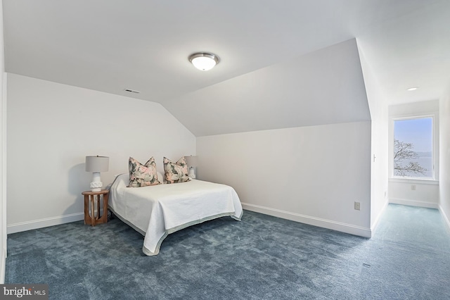 carpeted bedroom with vaulted ceiling, visible vents, and baseboards