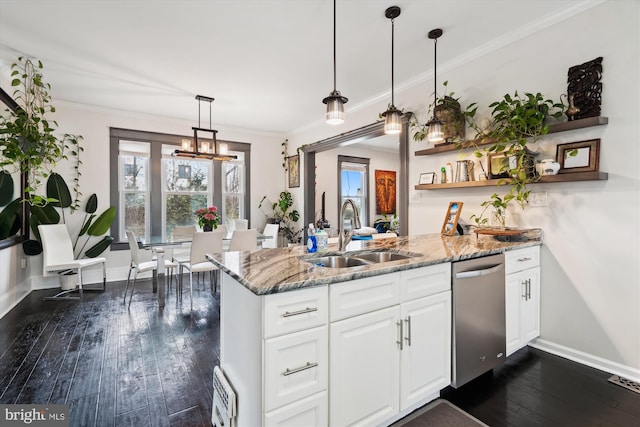 kitchen featuring dishwasher, a peninsula, dark wood-style floors, white cabinets, and a sink