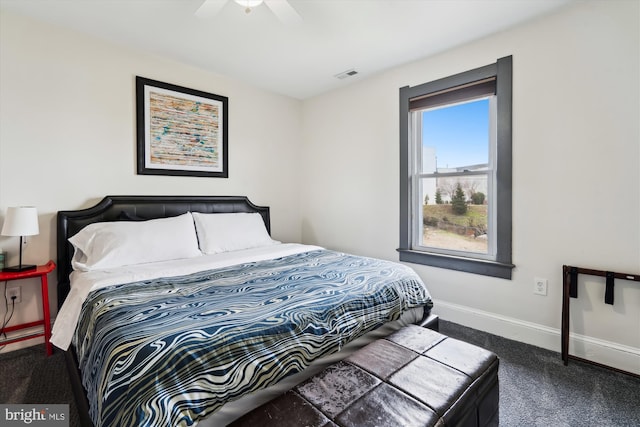 bedroom with visible vents, baseboards, carpet, and a ceiling fan