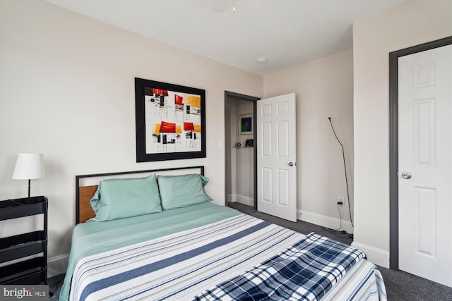 carpeted bedroom featuring baseboards