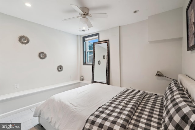 tiled bedroom with recessed lighting and a ceiling fan