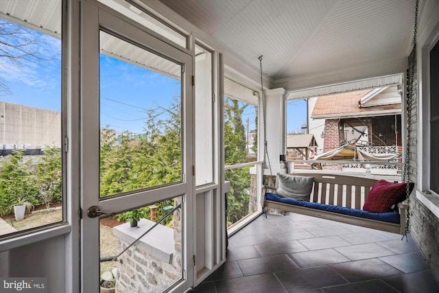 sunroom with vaulted ceiling