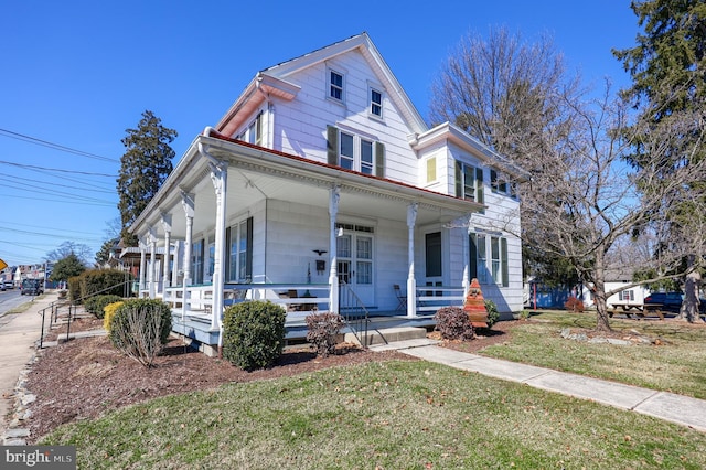 view of front of house with a front lawn and a porch