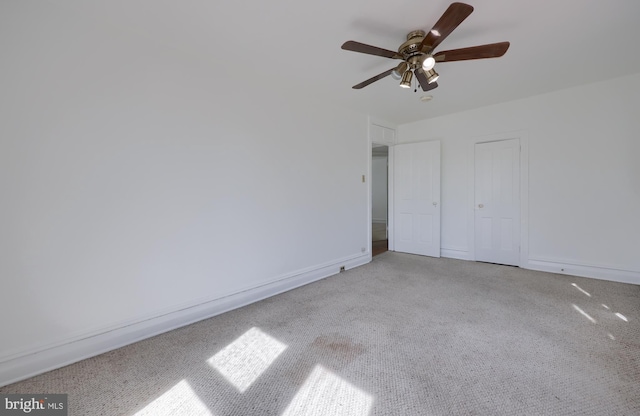 unfurnished bedroom featuring baseboards and a ceiling fan