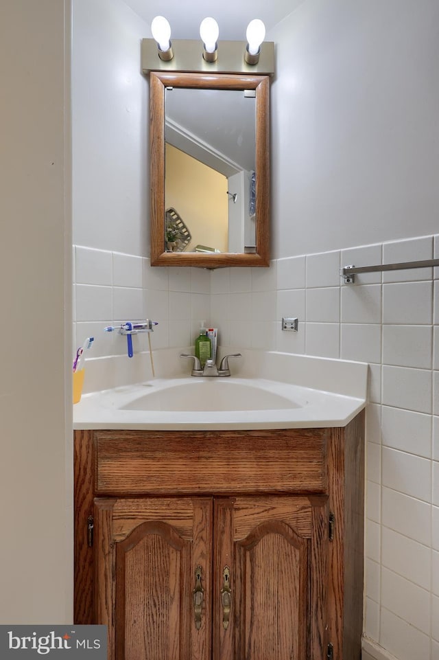 bathroom featuring tile walls and vanity