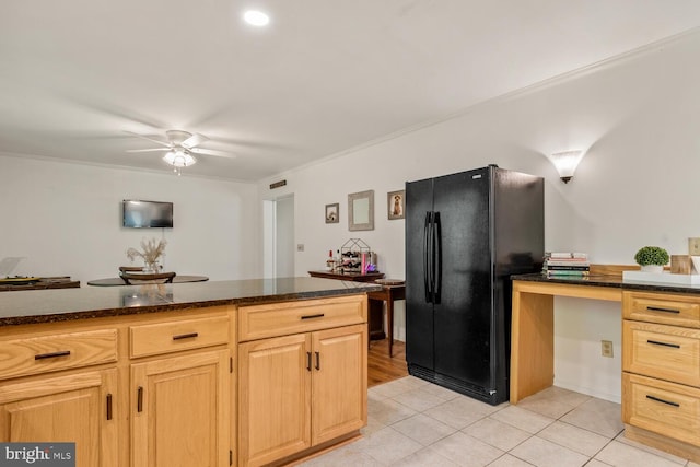 kitchen featuring crown molding, light tile patterned floors, freestanding refrigerator, light brown cabinets, and ceiling fan