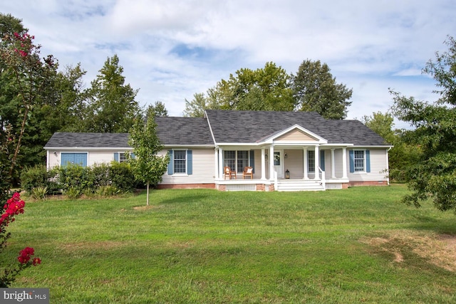 ranch-style house with a porch, roof with shingles, and a front lawn