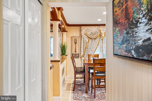 dining room featuring decorative columns and crown molding