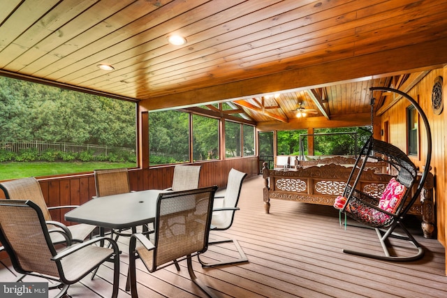 wooden deck with outdoor dining space and fence