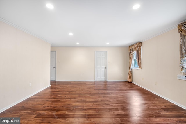 empty room featuring baseboards, wood finished floors, and recessed lighting