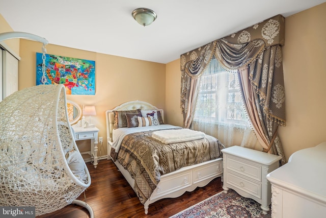 bedroom with wood finished floors