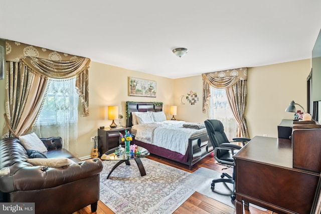 bedroom with wood finished floors