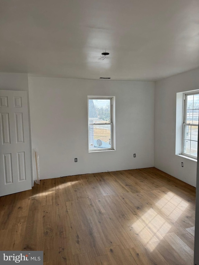 unfurnished room featuring wood-type flooring