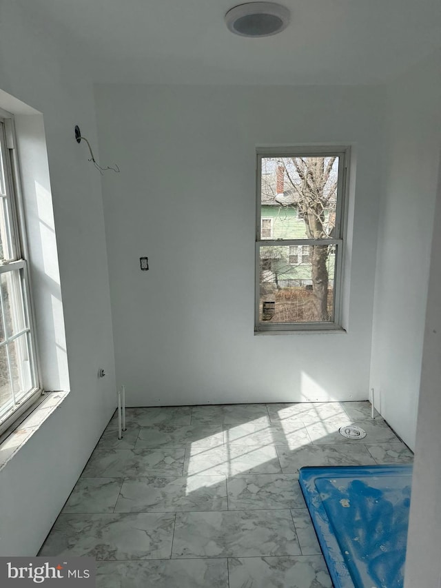 interior space featuring marble finish floor