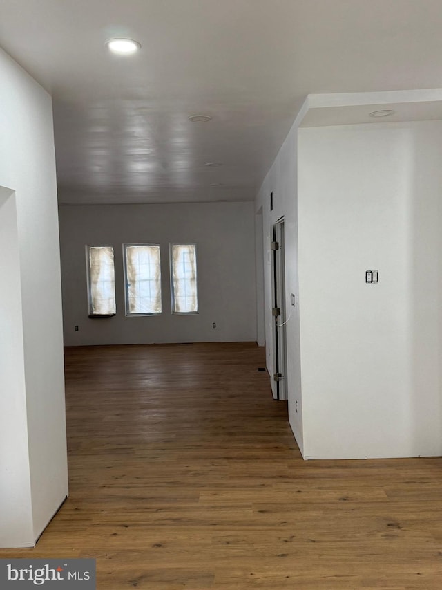 spare room with wood finished floors