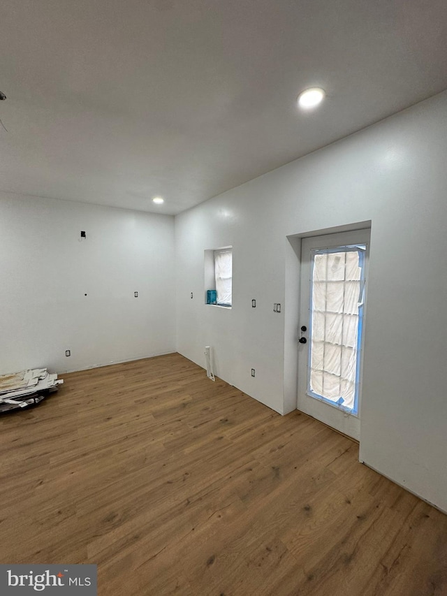 interior space featuring recessed lighting and wood finished floors