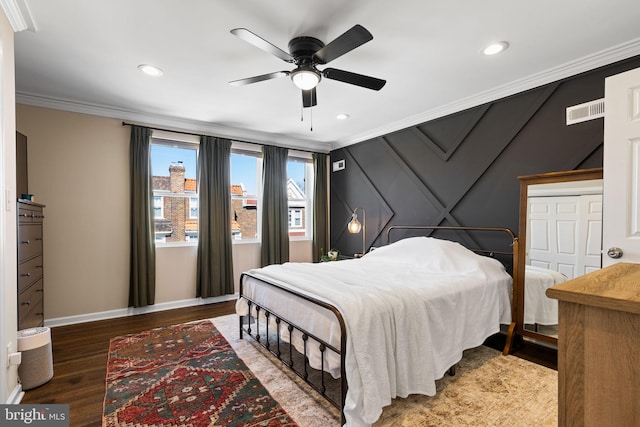 bedroom with visible vents, baseboards, ornamental molding, recessed lighting, and wood finished floors